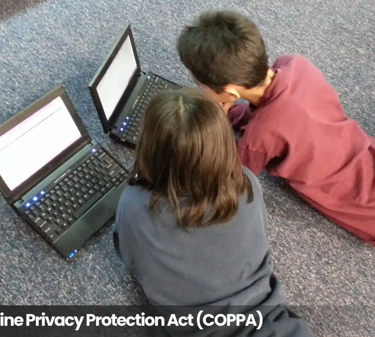 Two children using laptops, illustrating the Children’s Online Privacy Protection Act (COPPA) and online privacy for kids.