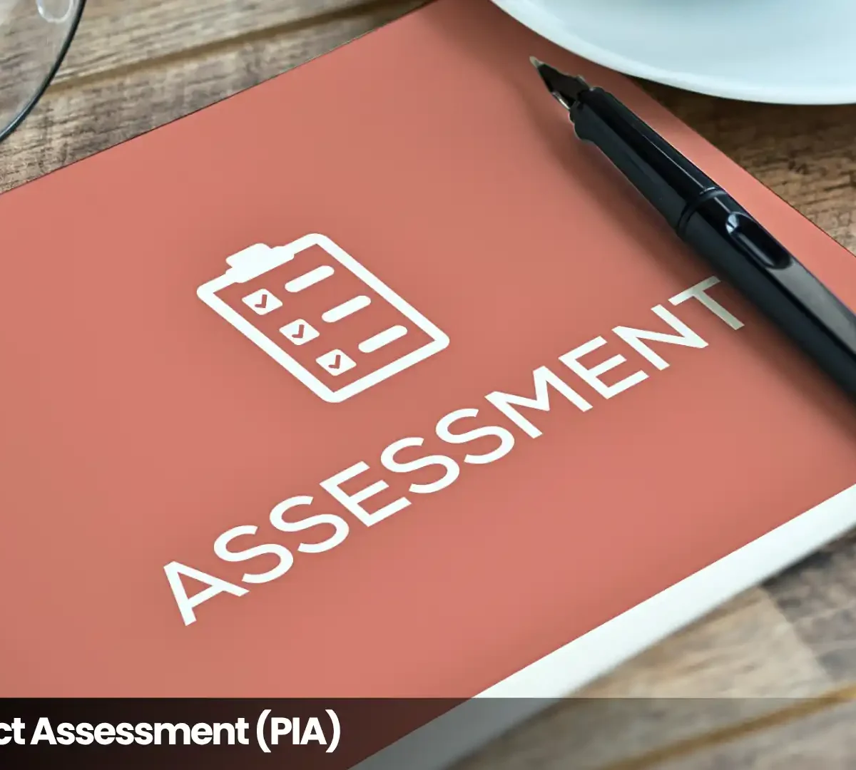 Privacy Impact Assessment (PIA) checklist on a desk with a pen, illustrating privacy risk and compliance assessment.