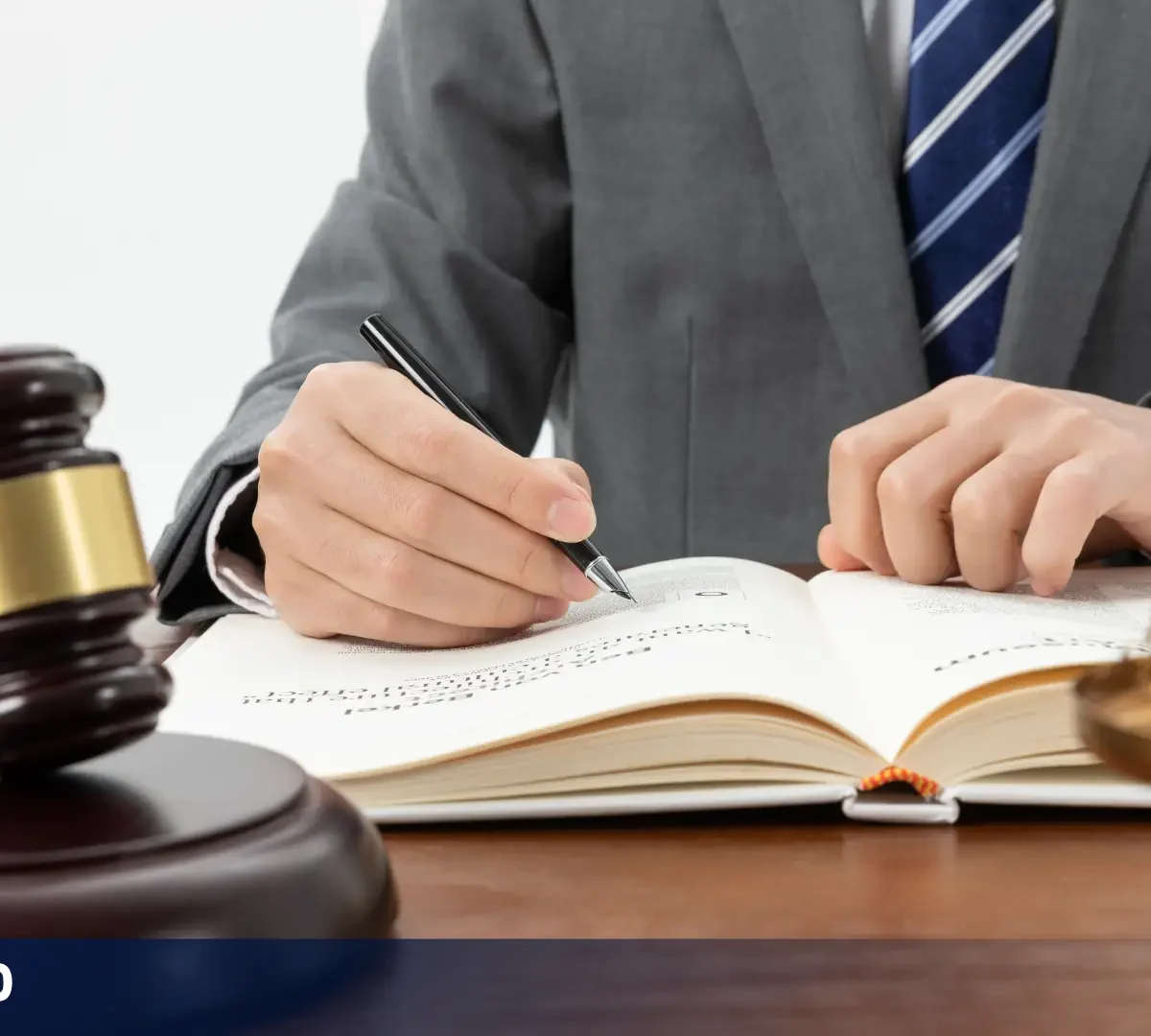 Person reviewing legal documents beside a gavel and scales of justice, representing California Senate Bill 690.